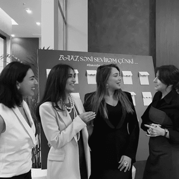 Members speaking together at an event